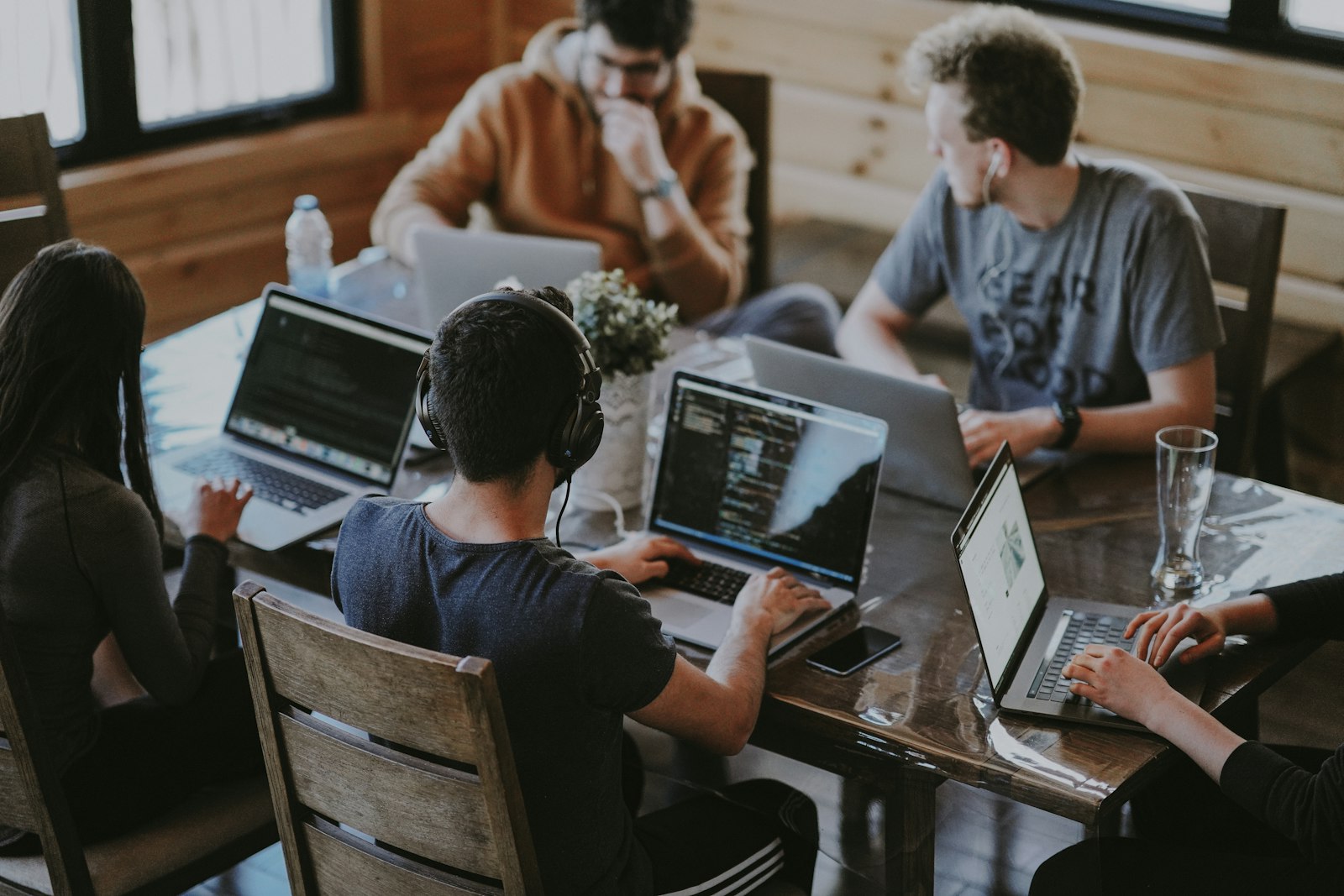 Build session — the team deep in code and strategy around one table